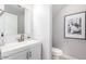 Stylish powder room with modern fixtures, a sleek vanity, and tasteful decor at 2604 N 27Th St # 4, Phoenix, AZ 85008