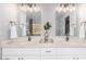 Bathroom with dual sinks, quartz countertops, and modern lighting at 2604 N 27Th St # 4, Phoenix, AZ 85008