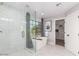 Bright bathroom with a walk-in glass shower and freestanding tub at 2604 N 27Th St # 4, Phoenix, AZ 85008