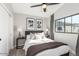 Cozy bedroom features natural light, neutral walls, ceiling fan and carpeted floor at 2604 N 27Th St # 4, Phoenix, AZ 85008