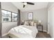 Bedroom featuring neutral walls, carpeted floor, ceiling fan and a picture window at 2604 N 27Th St # 4, Phoenix, AZ 85008