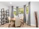Cozy dining room with a round table, comfortable chairs, and bright natural light from large windows at 2604 N 27Th St # 4, Phoenix, AZ 85008