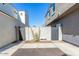 View of the exterior featuring grey color, two-story building, and driveway at 2604 N 27Th St # 4, Phoenix, AZ 85008