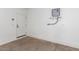 Spacious garage area features ample space for vehicles and storage, including a water heater and painted walls at 2604 N 27Th St # 4, Phoenix, AZ 85008