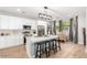 Well-lit kitchen with white cabinetry, stainless steel appliances, and an open layout to the dining area at 2604 N 27Th St # 4, Phoenix, AZ 85008