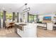 Bright and open kitchen featuring a stainless steel island sink, modern appliances, and seamless access to living areas at 2604 N 27Th St # 4, Phoenix, AZ 85008