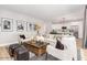 Open-concept living room with views into the kitchen, featuring stylish seating and modern accents at 2604 N 27Th St # 4, Phoenix, AZ 85008