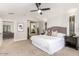 Bright main bedroom showcasing a large bed, stylish decor, and a view into the home at 2604 N 27Th St # 4, Phoenix, AZ 85008