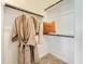 Walk-in closet with rods, shelves, and plush carpeting provides ample storage for clothing and accessories at 2942 N 98Th Ln, Phoenix, AZ 85037