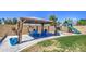 The backyard offers a covered patio area, playground, and ample space for outdoor activities and relaxation at 3016 N Glenview --, Mesa, AZ 85213