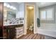 Spacious bathroom featuring dual sinks, and a separate toilet and bath/shower enclosure at 3016 N Glenview --, Mesa, AZ 85213