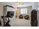Bright bedroom with a ceiling fan, plantation shutters, and neutral carpet, offering a cozy retreat at 3016 N Glenview --, Mesa, AZ 85213