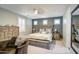 Bright main bedroom with ceiling fan, decorative pillows, and dark teal accent wall at 3016 N Glenview --, Mesa, AZ 85213