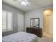 Bedroom featuring a dresser with mirror and plantation shutters on the window at 3016 N Glenview --, Mesa, AZ 85213