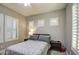 Cozy bedroom with plush bedding, plantation shutters, and soft, neutral decor at 3016 N Glenview --, Mesa, AZ 85213