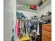 Organized walk-in closet with shelving and hanging storage for clothes and misc items at 3016 N Glenview --, Mesa, AZ 85213