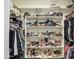 Organized walk-in closet with shelving and hanging storage for clothes and shoes at 3016 N Glenview --, Mesa, AZ 85213