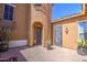 Charming courtyard with brick pavers, potted plants, and an inviting entrance to the home at 3016 N Glenview --, Mesa, AZ 85213