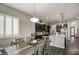 Dining room leading into kitchen showcasing dark wood cabinets, an island, and stainless steel appliances at 3016 N Glenview --, Mesa, AZ 85213