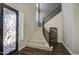 Elegant foyer with hardwood floors, staircase, decorative front door, and plenty of natural light at 3016 N Glenview --, Mesa, AZ 85213