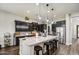 Stylish kitchen features dark cabinets, a large center island with seating, and stainless steel appliances at 3016 N Glenview --, Mesa, AZ 85213