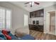 Inviting living room with hardwood floors, a ceiling fan, and built-in cabinets for storage at 3016 N Glenview --, Mesa, AZ 85213