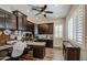 Office with built-in dark wood cabinets, granite countertops, and a ceiling fan at 3016 N Glenview --, Mesa, AZ 85213