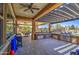 Spacious outdoor kitchen with stone counters, stainless appliances, and a beautiful pergola providing shade at 3016 N Glenview --, Mesa, AZ 85213