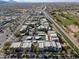 Extensive aerial view of the complex with a nearby golf course, canal, and roadways at 3434 E Baseline Rd # 213, Phoenix, AZ 85042