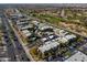 Aerial view of a landscaped complex adjacent to a canal and golf course at 3434 E Baseline Rd # 213, Phoenix, AZ 85042