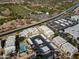A bird's eye view of the apartment complex featuring a pool and parking at 3434 E Baseline Rd # 213, Phoenix, AZ 85042