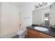 Bathroom featuring a vanity with a solid surface countertop, tub/shower and toilet at 3434 E Baseline Rd # 213, Phoenix, AZ 85042