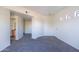 The bedroom has neutral carpet, small transom windows and access to the bathroom and closets at 3434 E Baseline Rd # 213, Phoenix, AZ 85042