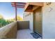 The front porch of unit #213 features a welcome mat and trellis at 3434 E Baseline Rd # 213, Phoenix, AZ 85042