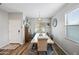 Bright dining room features a large table, seating for eight, and natural light at 37340 W Merced St, Maricopa, AZ 85138