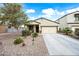 Inviting single-Gathering home showcasing a manicured front yard, a two-car garage, and a welcoming facade at 37340 W Merced St, Maricopa, AZ 85138