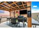 Outdoor grill with American flag, flat screen TV, Traeger grill and built-in storage, perfect for entertaining at 37340 W Merced St, Maricopa, AZ 85138