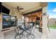 An outdoor kitchen with a dining area and covered patio, ideal for entertaining and enjoying outdoor meals at 37340 W Merced St, Maricopa, AZ 85138