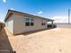 Back exterior shows the building, the backyard and a covered patio at 4029 S 176Th Dr, Goodyear, AZ 85338