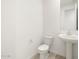 Bright powder room with pedestal sink and modern fixtures at 4029 S 176Th Dr, Goodyear, AZ 85338