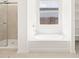Bathroom featuring a shower, tub, and open shelving at 4029 S 176Th Dr, Goodyear, AZ 85338