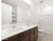 Well-lit bathroom featuring a double sink vanity, large mirror, and bathtub with shower at 4029 S 176Th Dr, Goodyear, AZ 85338