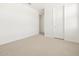 Bright bedroom featuring neutral carpet and a doorway into another room at 4029 S 176Th Dr, Goodyear, AZ 85338