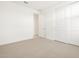 Bright bedroom featuring neutral carpet and double door closet at 4029 S 176Th Dr, Goodyear, AZ 85338