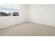 Bright bedroom featuring neutral carpet and natural light from the window at 4029 S 176Th Dr, Goodyear, AZ 85338
