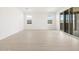 Bright living space with wood-look flooring, natural light, and sliding glass doors to the backyard at 4029 S 176Th Dr, Goodyear, AZ 85338
