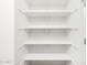 A well-organized, walk-in pantry with multiple shelves for ample storage at 4029 S 176Th Dr, Goodyear, AZ 85338