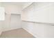Spacious walk-in closet featuring ample shelving and rods for organized storage solutions at 4029 S 176Th Dr, Goodyear, AZ 85338