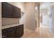 Hallway with tile flooring, storage and neutral color palette at 4628 E Gelding Dr, Phoenix, AZ 85032