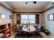 Well lit home office with built-in desk, cabinets and bright natural light at 4628 E Gelding Dr, Phoenix, AZ 85032